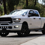 RAM 2500 Fog Light Kit installed on white RAM 2500 truck with upgraded LED fog lights illuminated on front bumper