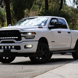 RAM 2500 Fog Light Kit installed on white RAM 2500 truck with upgraded LED fog lights illuminated on front bumper