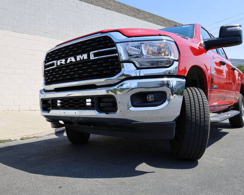 RAM 2500 lightbar Bumper Light kit installed on 2019-2024 RAM 2500 front bumper with LED lower grille light pods