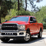 RAM 2500 lightbar Bumper Light kit installed with lower grille light pods on red 2019-2024 RAM 2500 truck front view