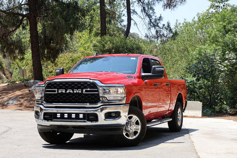 RAM 2500 lightbar Bumper Light kit installed with lower grille light pods on red 2019-2024 RAM 2500 truck front view