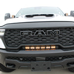 RAM RHO light bar PRO 23in curved LED installed between grille and bumper on 2025 RAM 1500 RHO truck front view