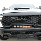 RAM RHO light bar PRO 23in curved LED installed between grille and bumper on 2025 RAM 1500 RHO truck front view