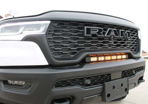 RAM RHO light bar PRO curved LED installed between grille and bumper on 2025 RAM 1500 RHO front bumper