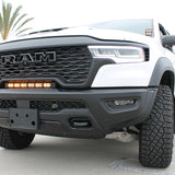 RAM RHO light bar PRO 23in curved LED installed between grille and bumper on 2025 RAM 1500 RHO truck front view