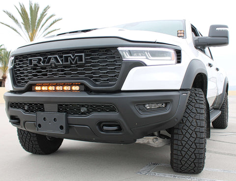 RAM RHO light bar PRO 23in curved LED installed between grille and bumper on 2025 RAM 1500 RHO truck front view