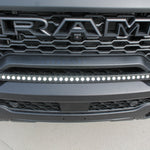 RAM RHO Lightbar on RAM RHO 2025+ 1500 bumper; curved slim LED lightbar with black powder-coated bracket, no grille cutting