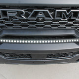 RAM RHO Lightbar on RAM RHO 2025+ 1500 bumper; curved slim LED lightbar with black powder-coated bracket, no grille cutting