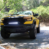 RAM TRX Light bar slim 23in curved LED in factory grille opening on yellow 2021-2024 RAM 1500 TRX front view