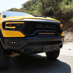 RAM TRX Light bar slim 23in installed in grille opening on yellow 2021-2024 RAM 1500 TRX front view