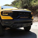 RAM TRX Light bar slim 23in installed in grille opening on yellow 2021-2024 RAM 1500 TRX front view