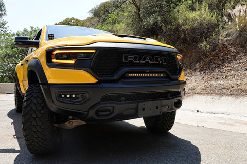 RAM TRX Light bar slim 23in installed in grille opening on yellow 2021-2024 RAM 1500 TRX front view