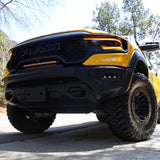 RAM TRX Light bar slim 23in mounted in grille opening on yellow 2021-2024 RAM 1500 TRX front view