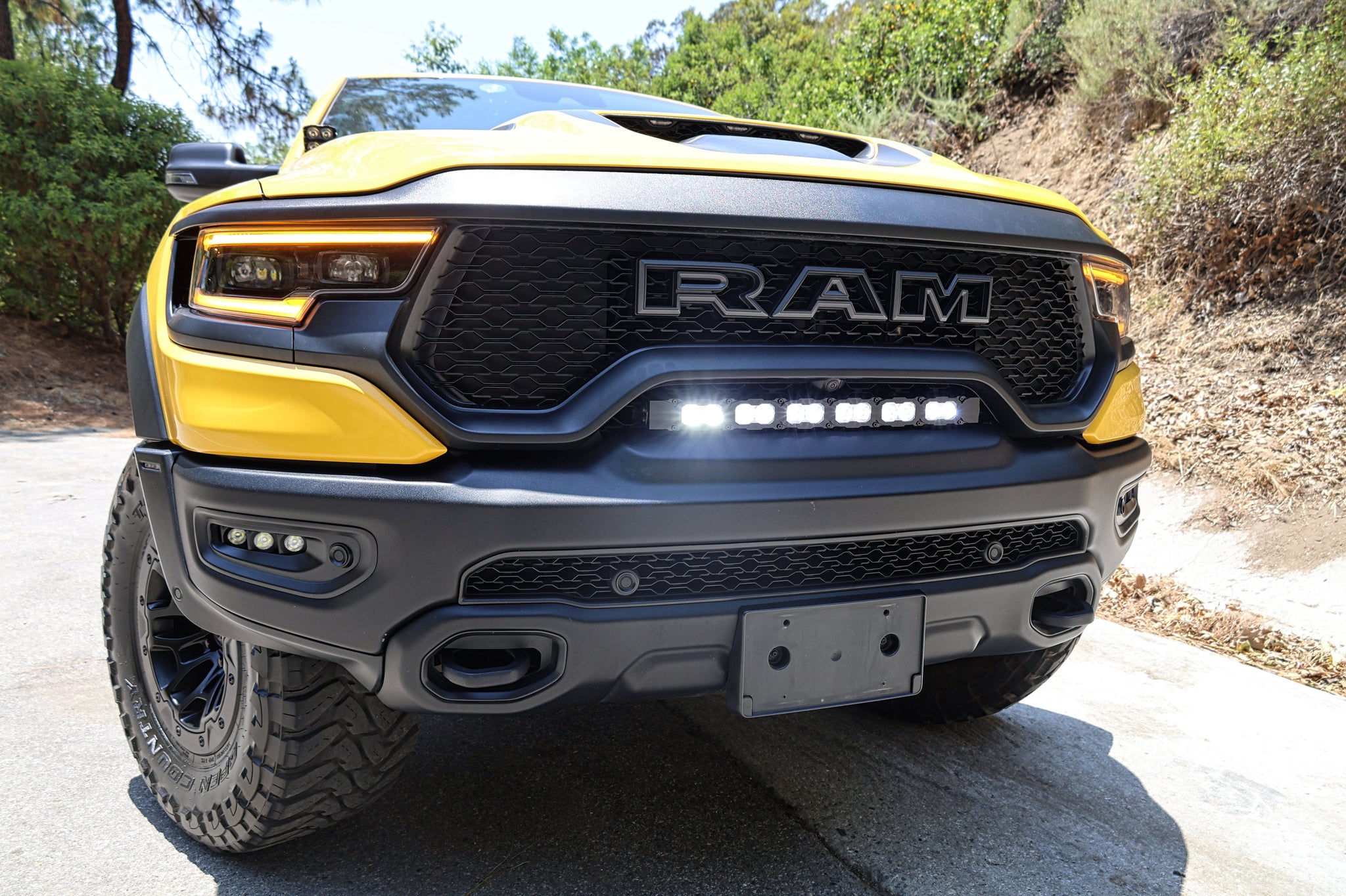 RAM TRX Lightbar 23in PRO installed in grille opening on 2021-2024 RAM 1500 TRX front bumper