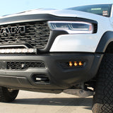 RAM RHO FOG light kit on 2025+ RAM 1500 - bolt-on factory openings, black powder-coated bracket visible with LED fog lights