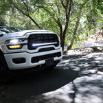 2025+ RAM 2500 light bar slim 40in installed on white RAM 2500 truck parked on shaded forest road