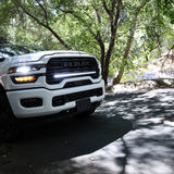 2025+ RAM 2500 light bar slim 40in installed on white RAM 2500 truck parked on shaded forest road