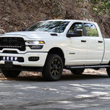 2025+ RAM 2500 Light kit with lower grille LED pods installed on white RAM 2500 truck parked on roadside