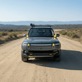 gray 2024 rivian with ditch lights for off roading 