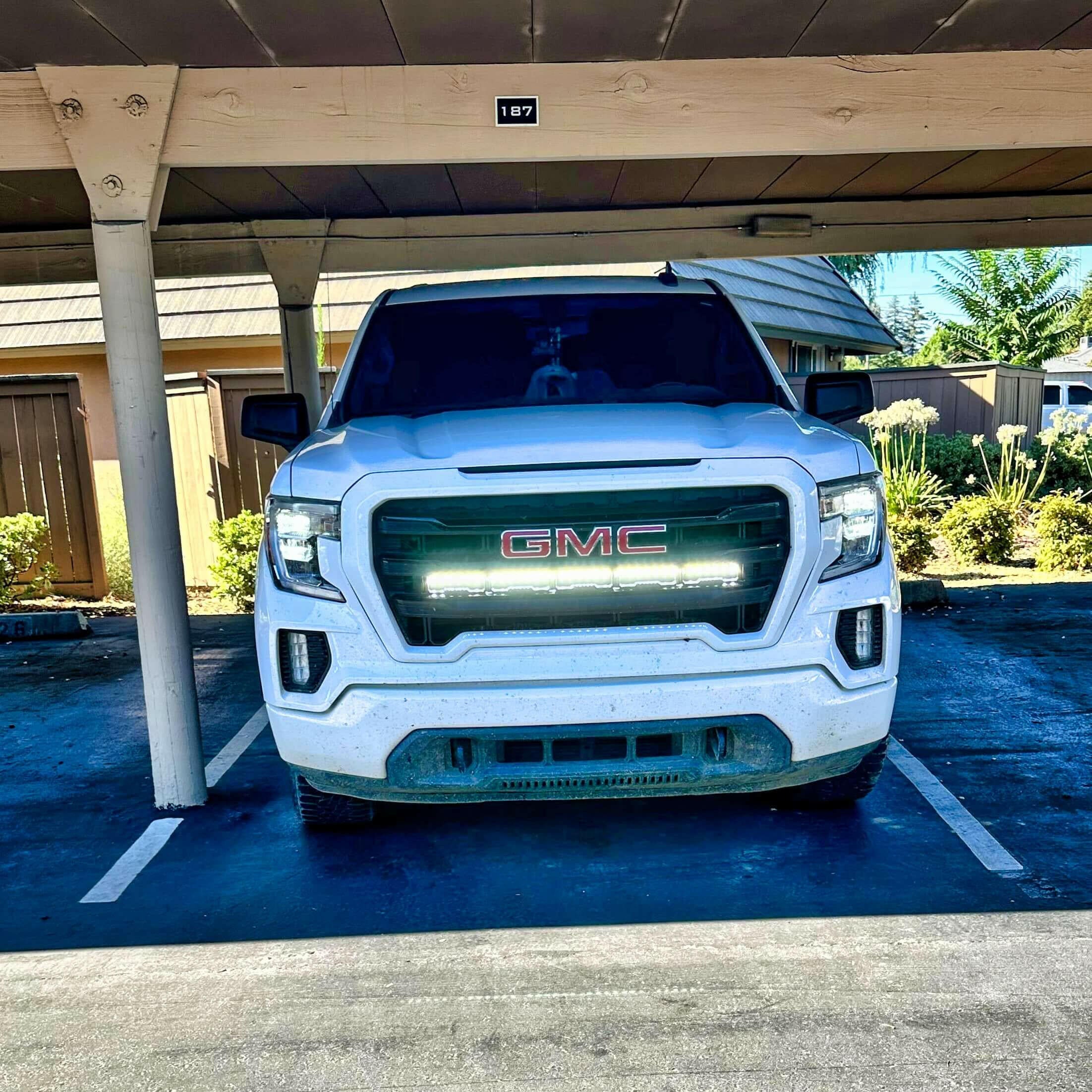 2019 2020 2021 2022 2023 white GMC Sierra 1500 with one white 40in behind grille light bar