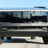 black tesla cybertruck with curved LED light bar in the bumper