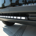 close up view black tesla cybertruck with curved white LED light bar m&r automotive 