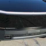 top view black cybertruck with white LED light bar curved n the bumper