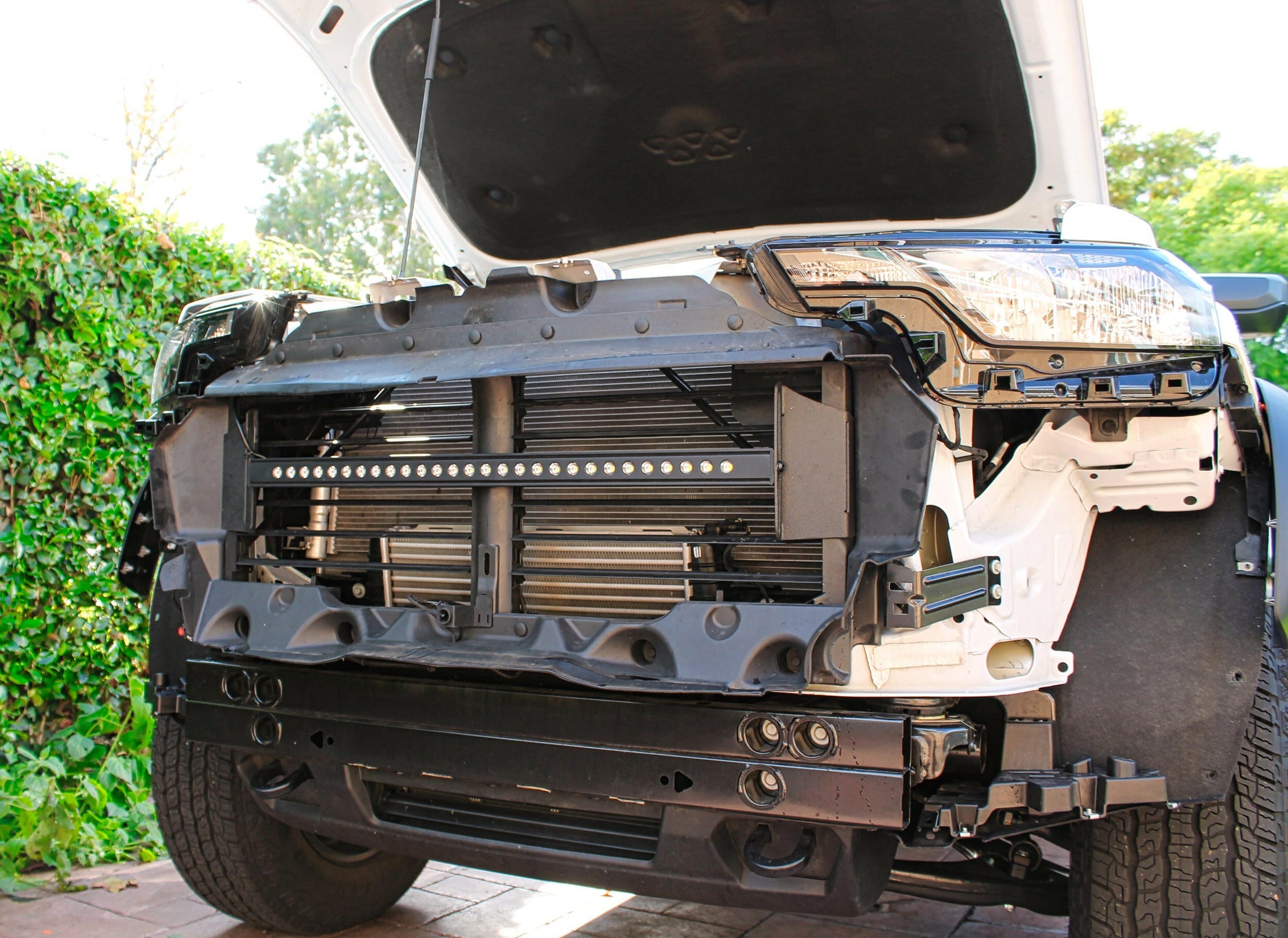 2023 2024 white chevrolet colorado with behind grille 30in light bar grille off
