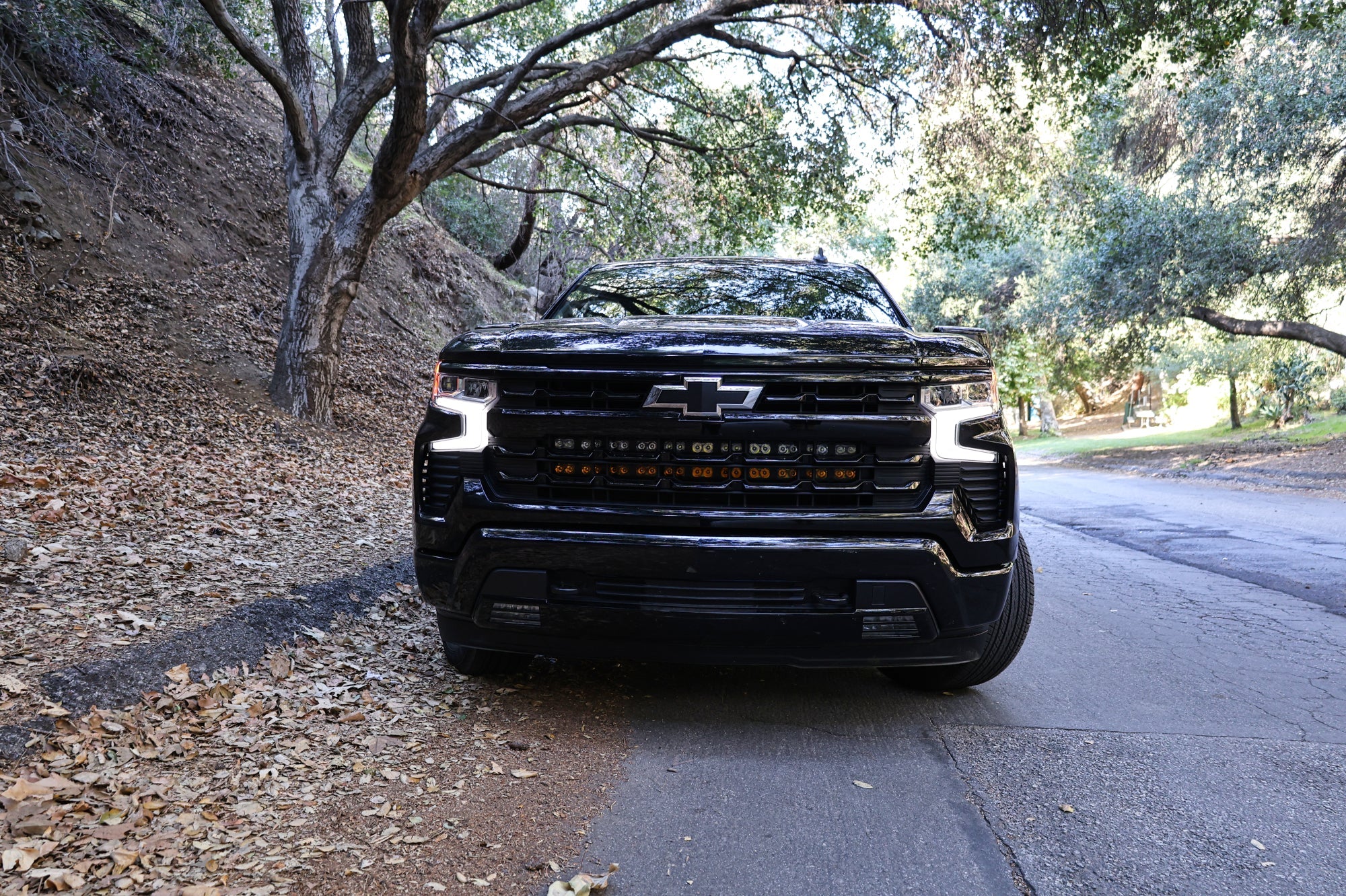 chevrolet silverado 1500 Light Bars PRO installed on 2022+ Silverado 1500 front grille on forest road