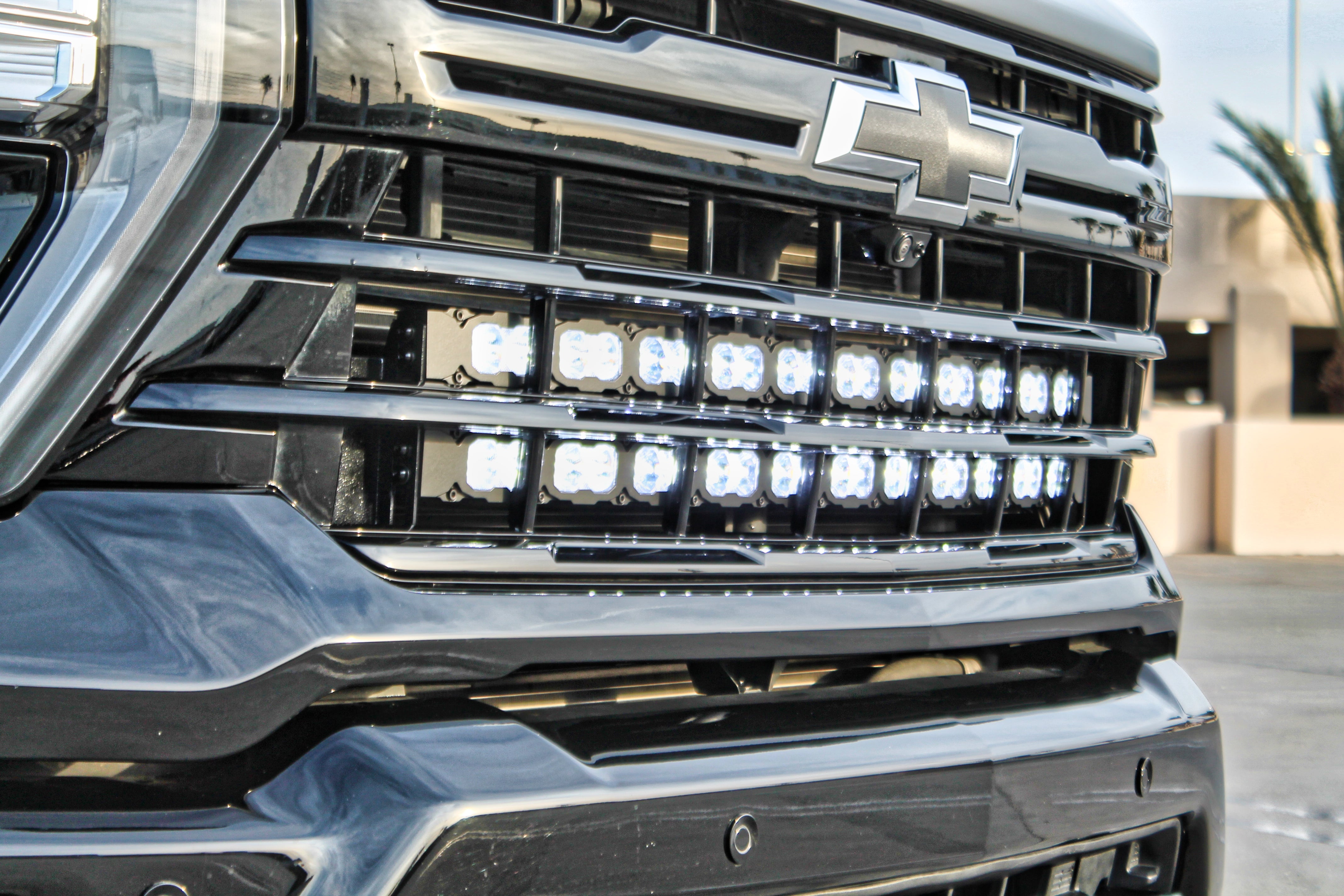Chevrolet Silverado Light Bars on 2020-2026 Silverado 2500/3500HD grille with dual row LED light bars, mounts on lower grille rail system, fits High Country LTZ LT WT trims