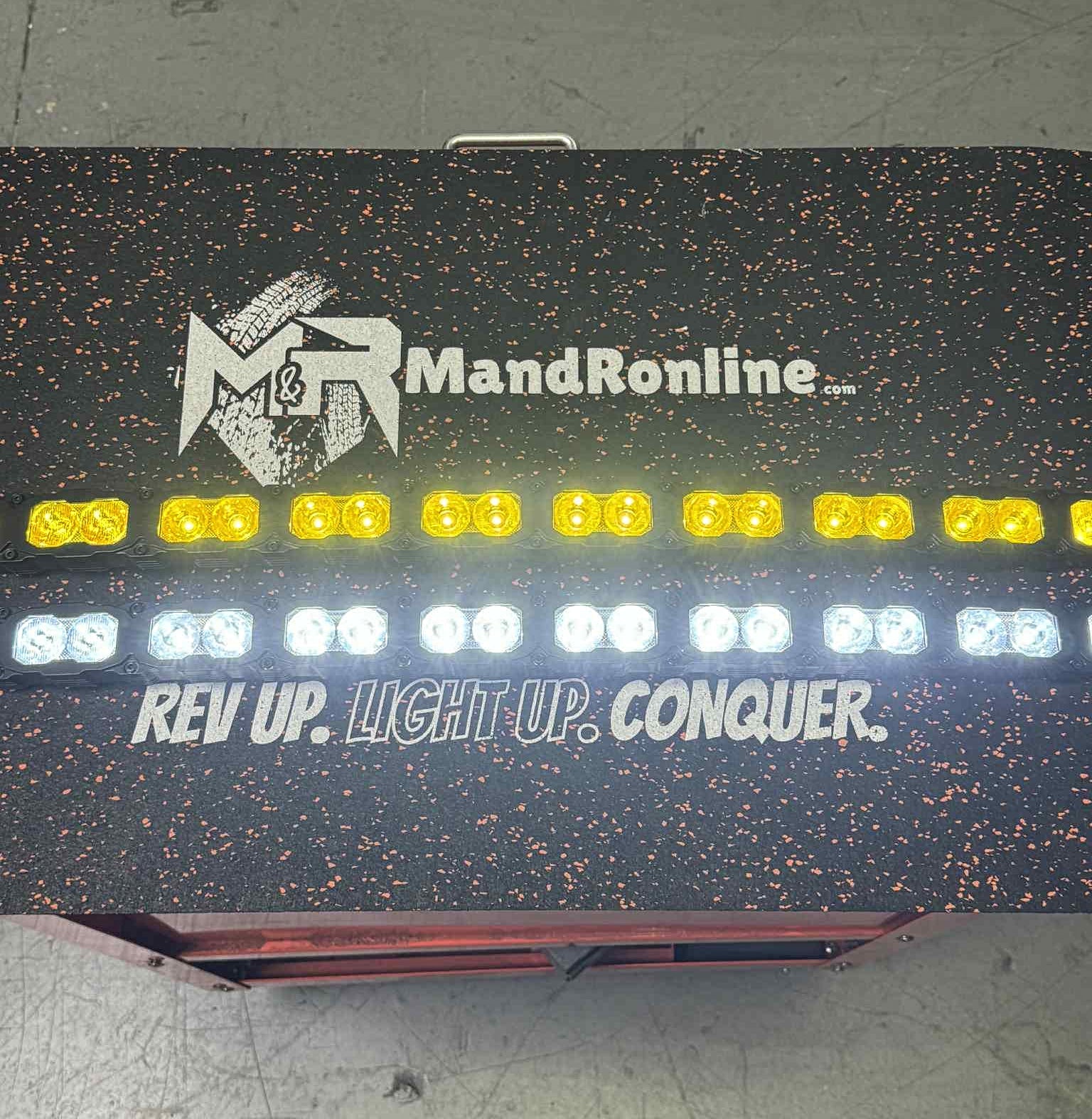 Chevrolet Silverado Light Bars on a M&R MandRonline setup with dual 40s, LED yellow and white lights, bottom grille mounting, REV UP. LIGHT UP. CONQUER.