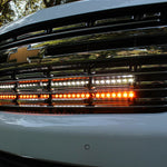 front view of grille 2021 Chevrolet Suburban with 2 led lights bars behind the grille amber and white for off roading