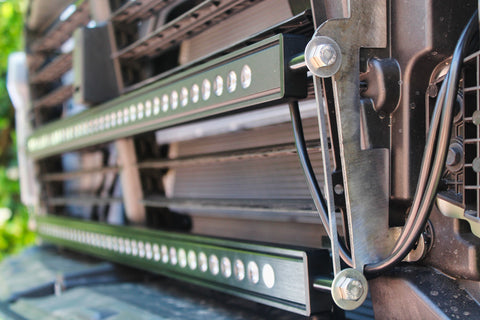 uplcose view of silverado light brackets behind grille