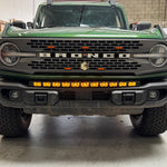green 20213bronco capable bumper with led light bar installed on top for off roading amber day time running lights