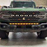 green 20213bronco capable bumper with led light bar installed on top for off roading amber day time running lights