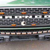 top of view green 2023 bronco capable bumper with led light bar installed on top for off roading