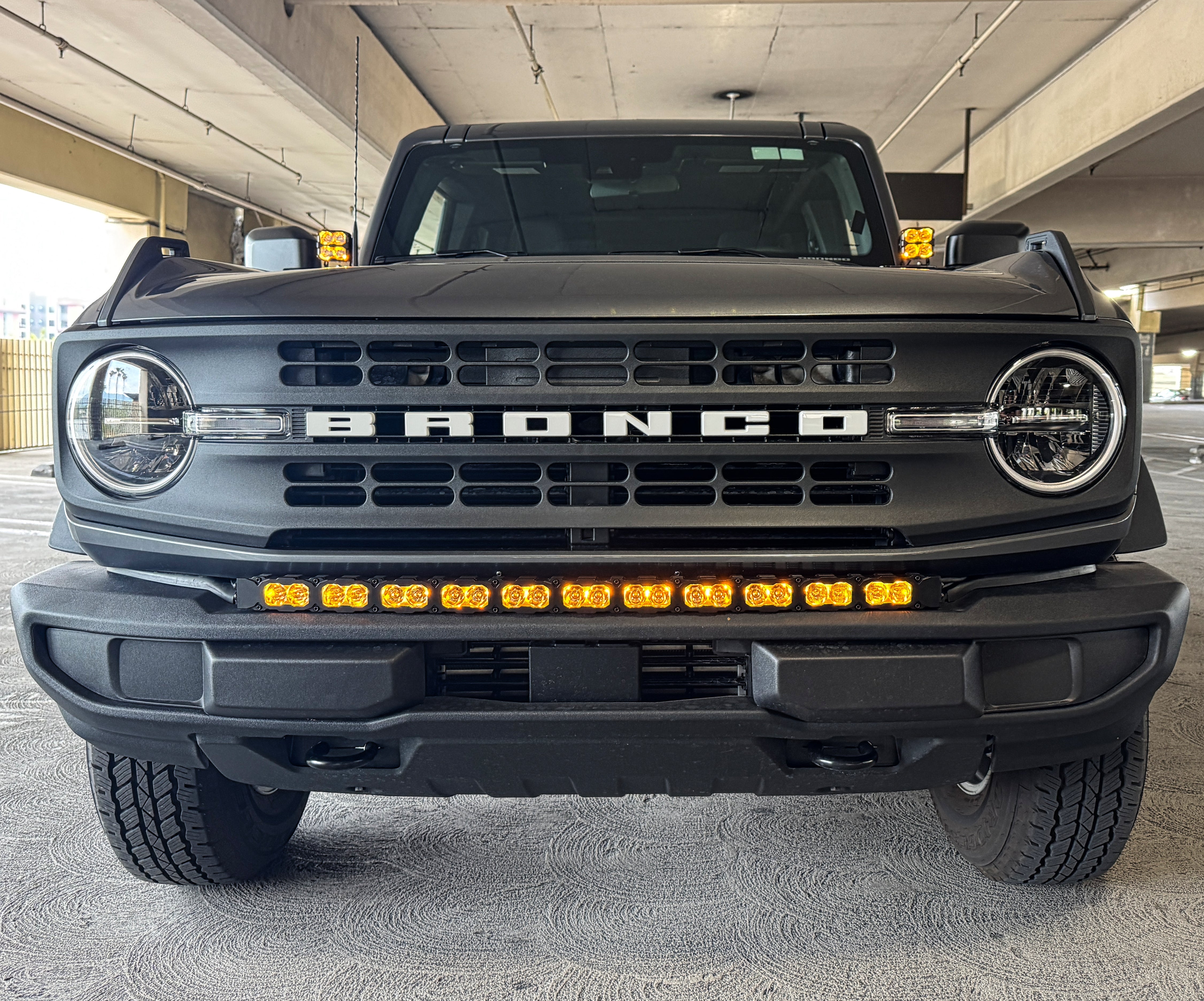 Ford Bronco Ditch Lights - PRO: Dual color white LED with amber DRL backglow on 2021-2026 Ford Bronco front grille shot