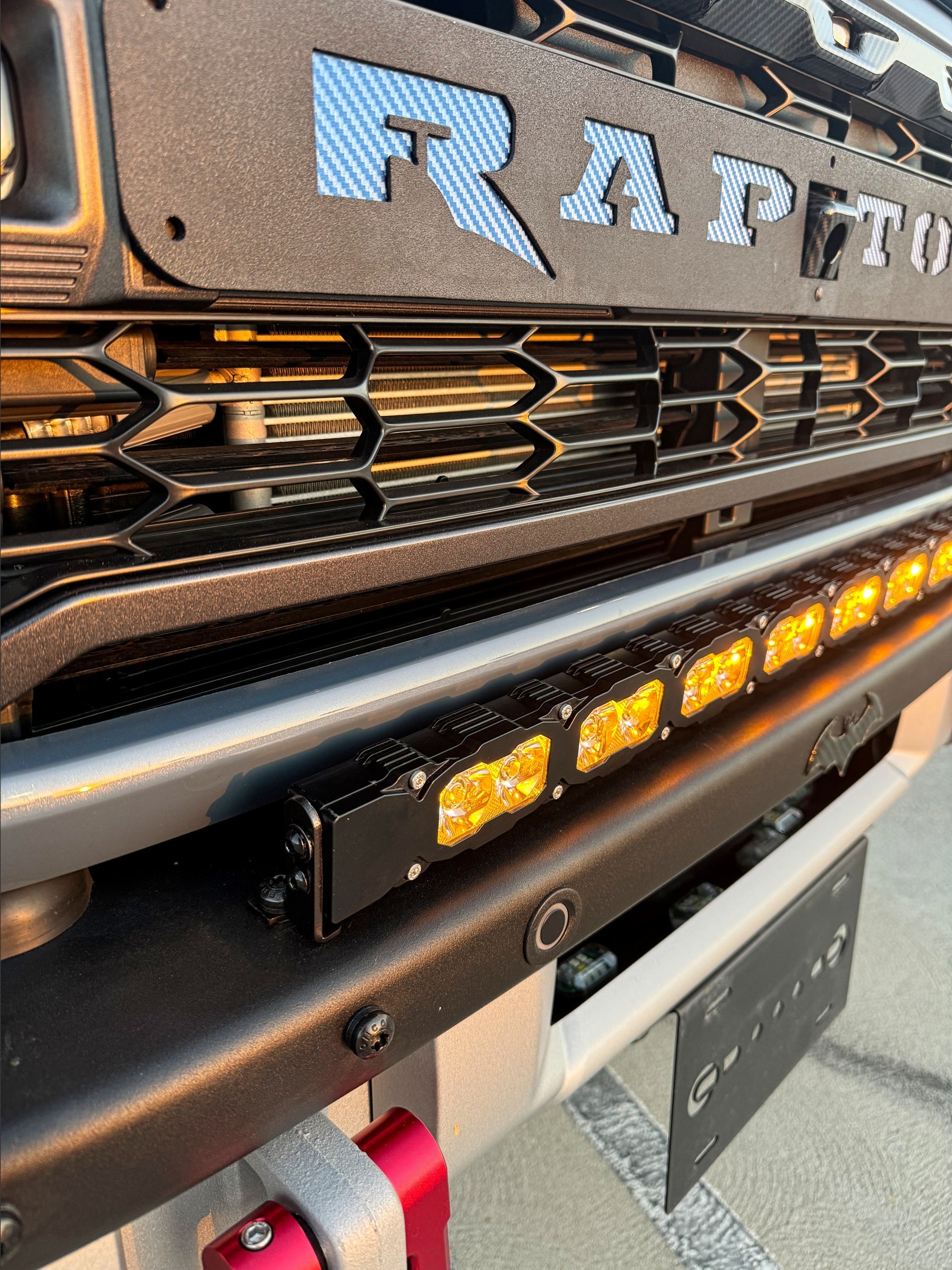 Ford Bronco Raptor 30in Light Bar installed on bumper with black powder-coated bracket, close-up front view