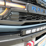 side view ford bronco raptor with white curved led light bar on top of bumpe