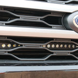 up close view of ford expedition with behind grille led light bar for off roading