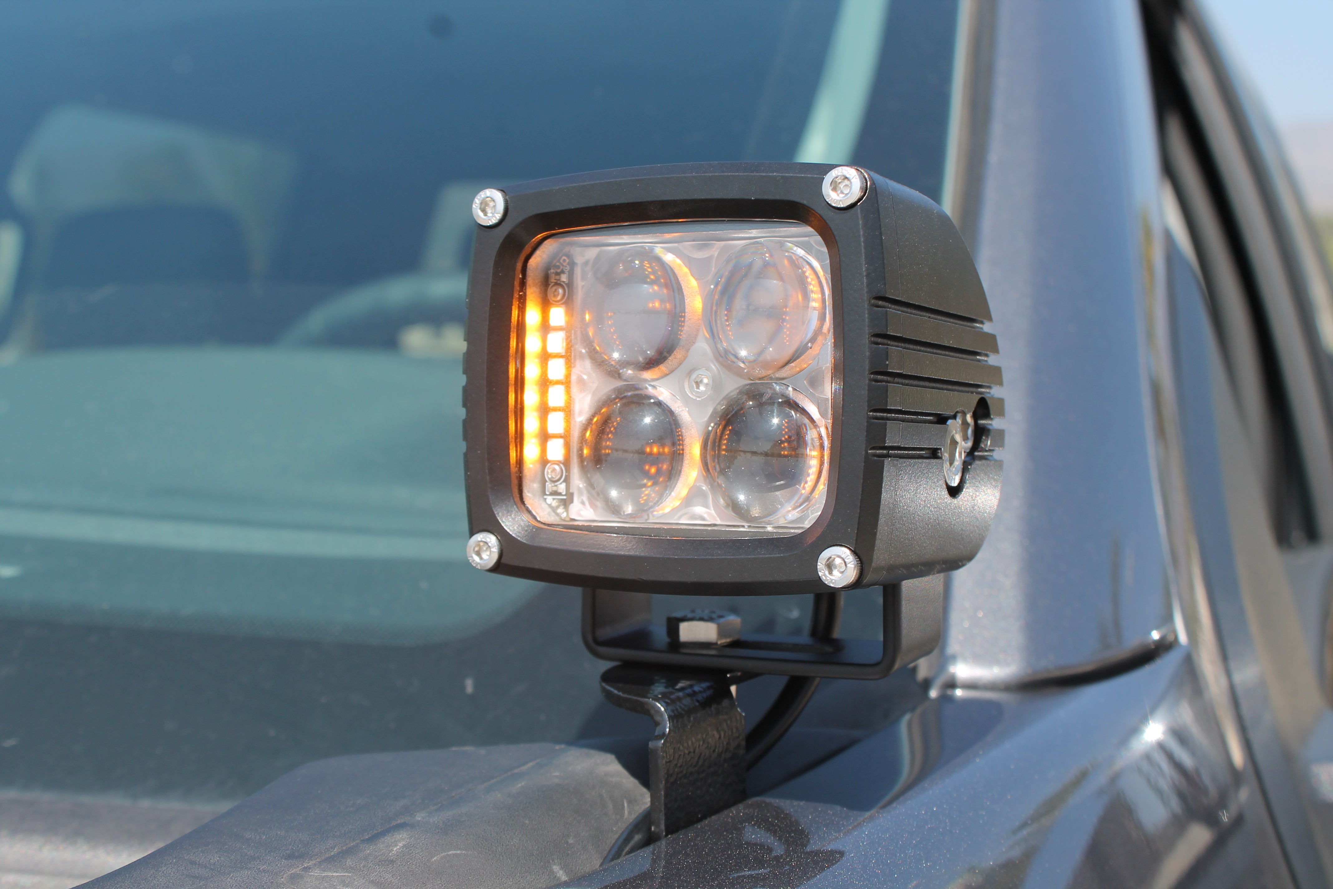 Ford F150 ditch lights mounted on hood, 4-LED amber DRL glow and white main beam, 2024+ Ford F150 compatible