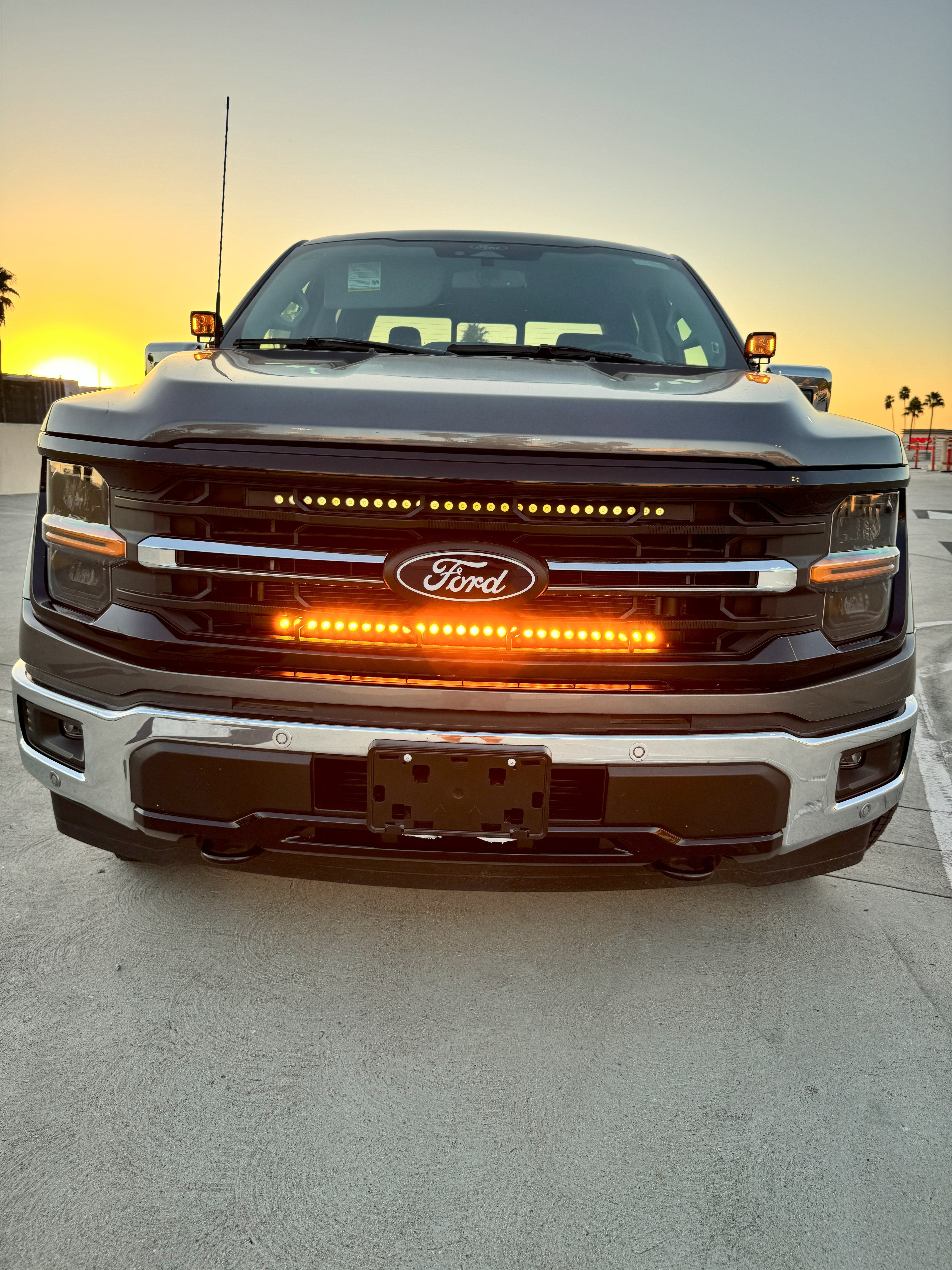 2024+ Ford F150 dual 30in Light Bars on front grille during sunset - bolt-on Ford F-150 lighting kit, fits 2024-2026 models