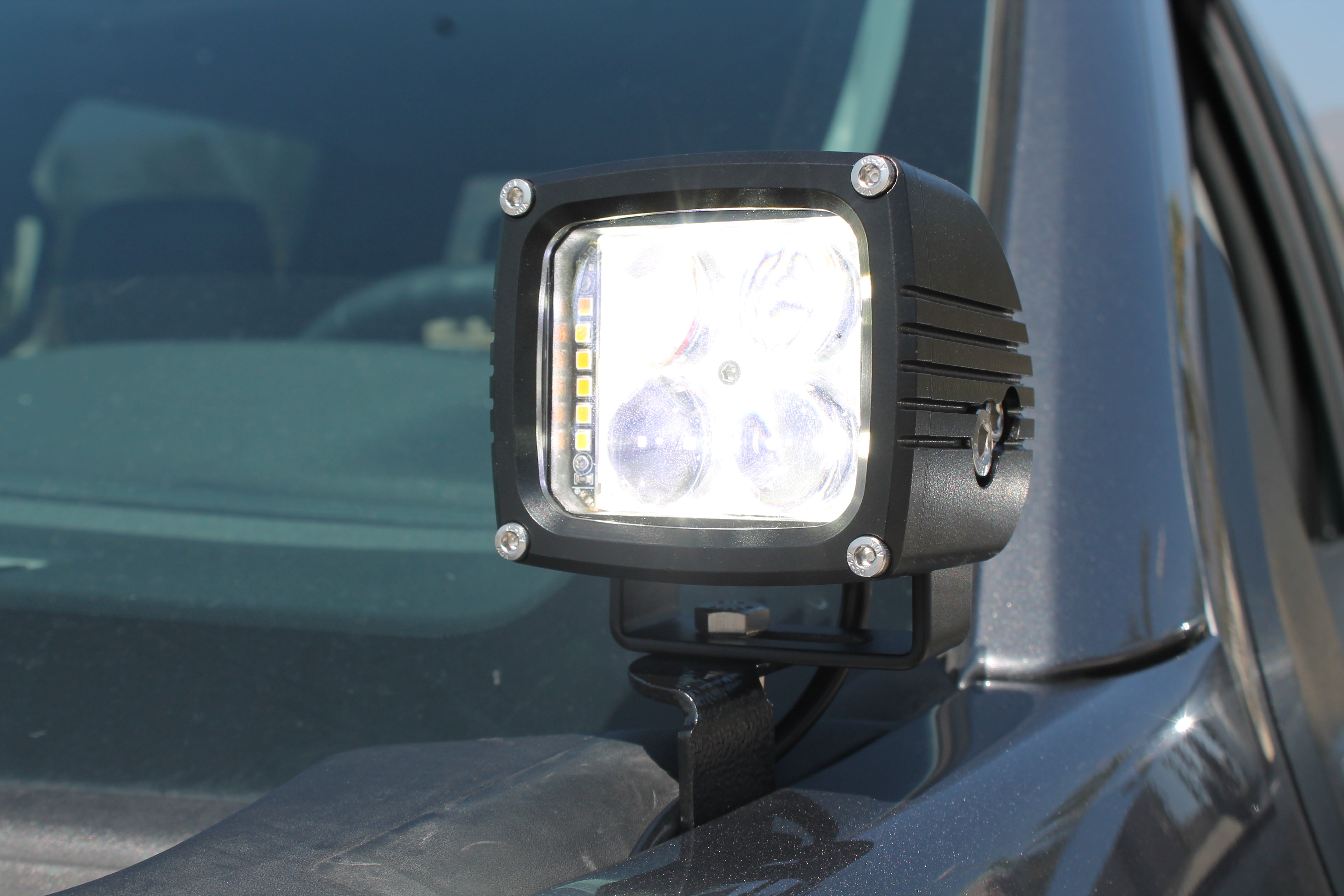 Ford F150 ditch lights mounted on hood for 2024+ with amber DRL backglow and dual-function LED pods