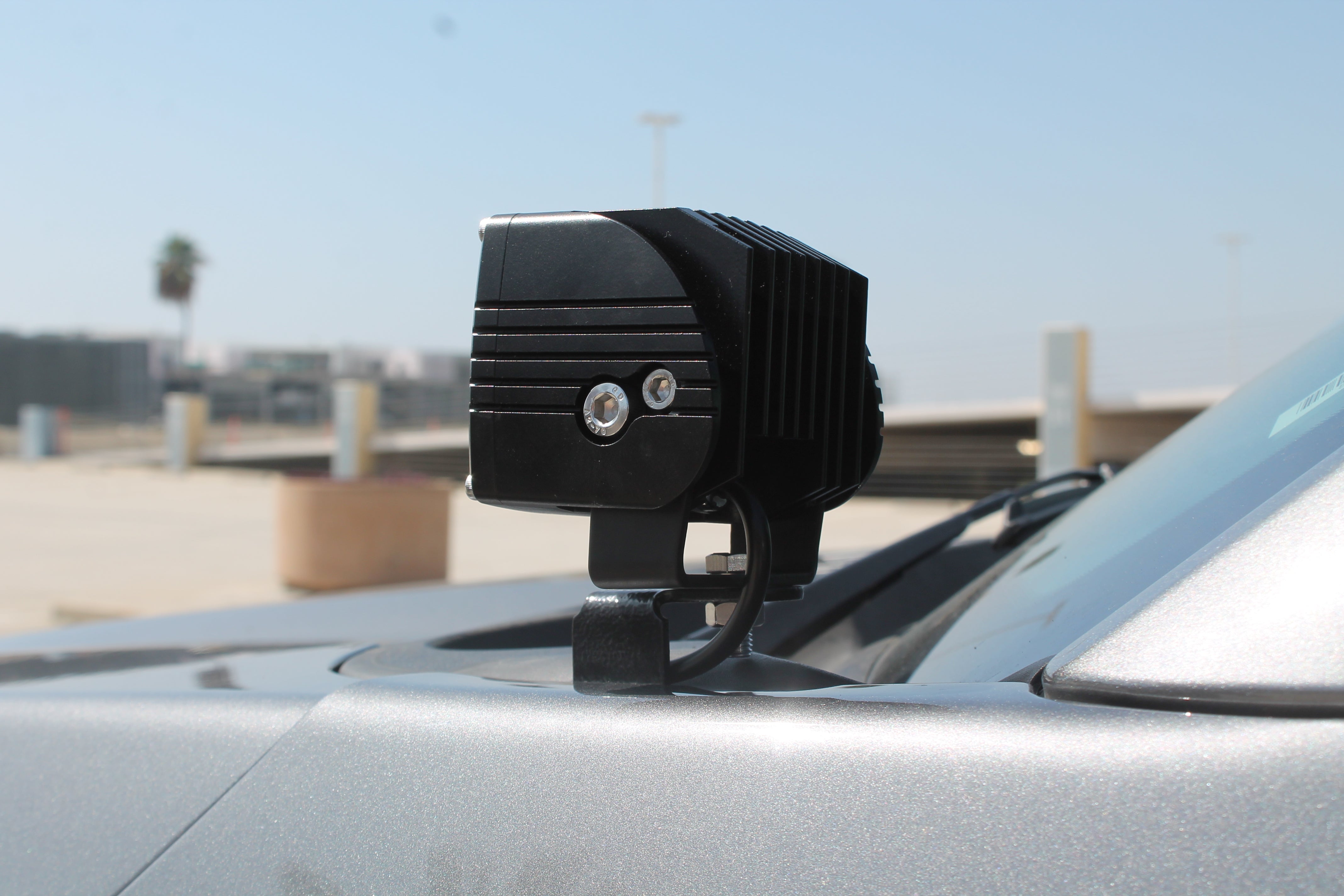 Ford F150 ditch lights mounted on hood with dual-function amber DRL backglow