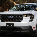 Ford Maverick Ditch Lights 2025+ dual color amber DRL installed on white Ford Maverick front view in wooded setting