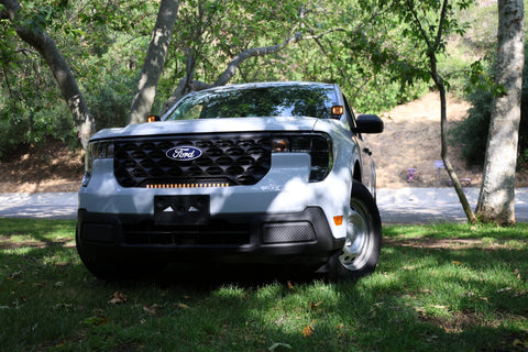 Ford Maverick Ditch Lights on 2025 Ford Maverick truck with dual color white LED and amber DRL backglow in daylight park setting