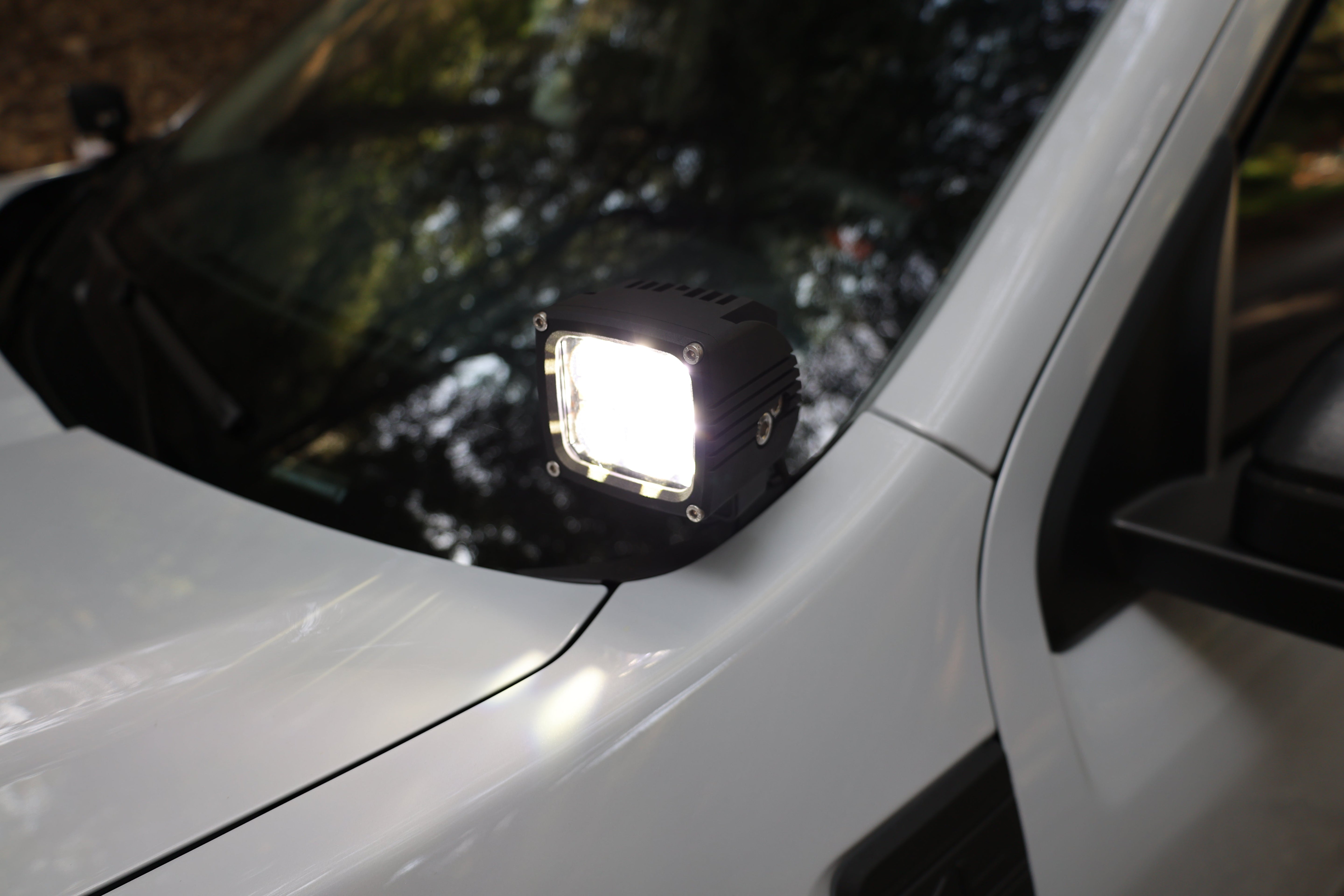 Ford Maverick Ditch Lights 2025 dual color LED ditch light mounted near windshield on white Maverick truck