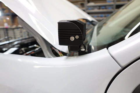 Ford Maverick Ditch Lights 2025+ installed on hood cowl bracket showing dual color LED housing detail