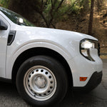 Ford Maverick Ditch Lights installed on white 2025 Ford Maverick truck front fender and headlight close-up
