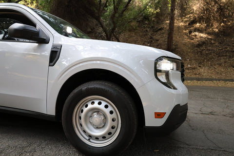 Ford Maverick Ditch Lights installed on white 2025 Ford Maverick truck front fender and headlight close-up